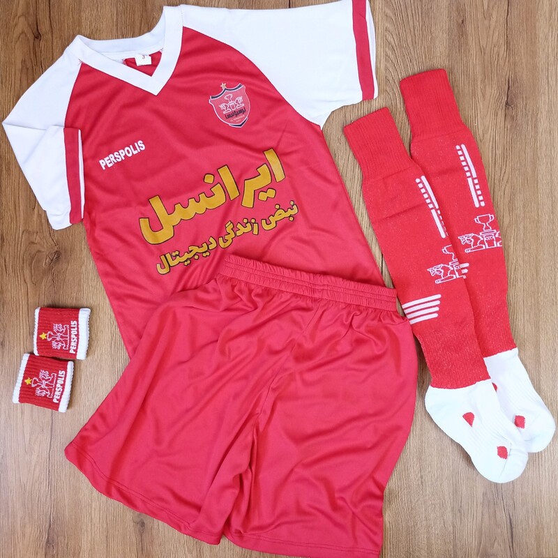 خرید ست ورزشی  پرسپولیس  بچگانه به همراه پاکش و مچبند
